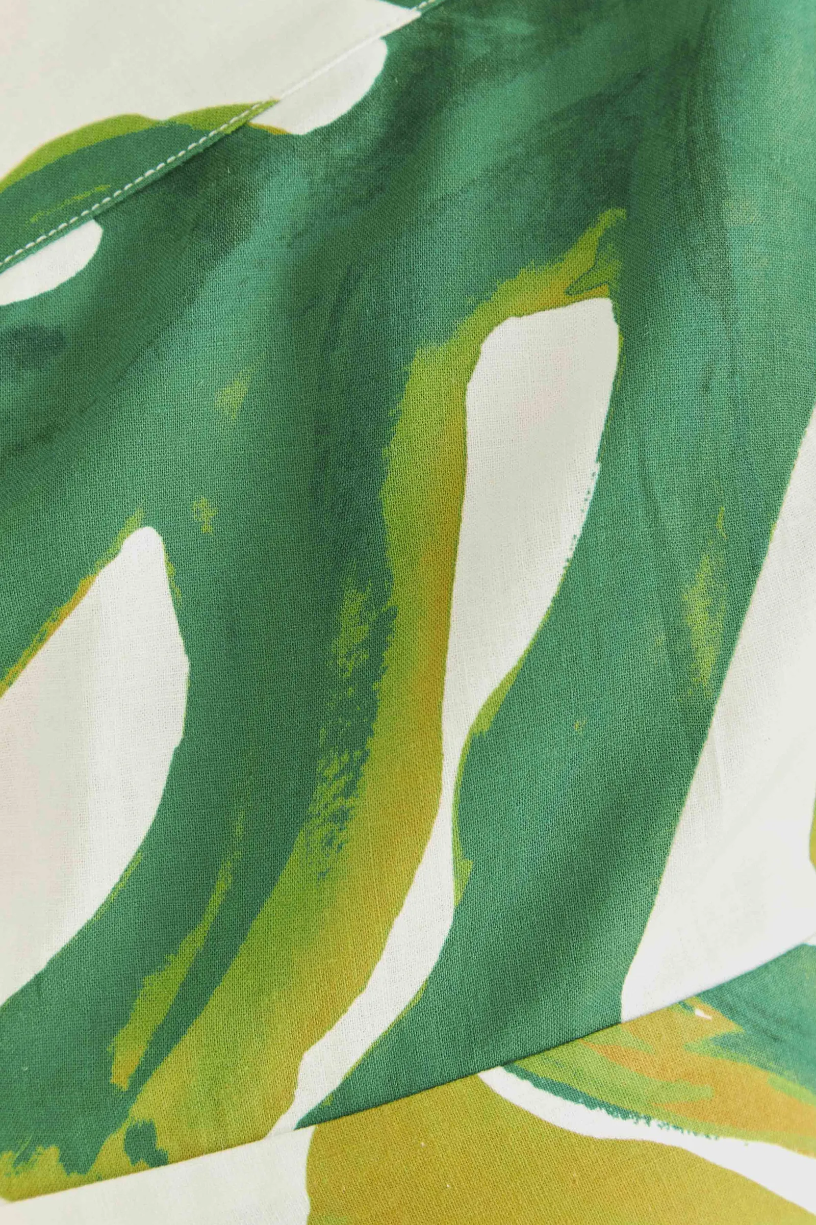 WHITE MONSTERA ONE SHOULDER JUMPSUIT